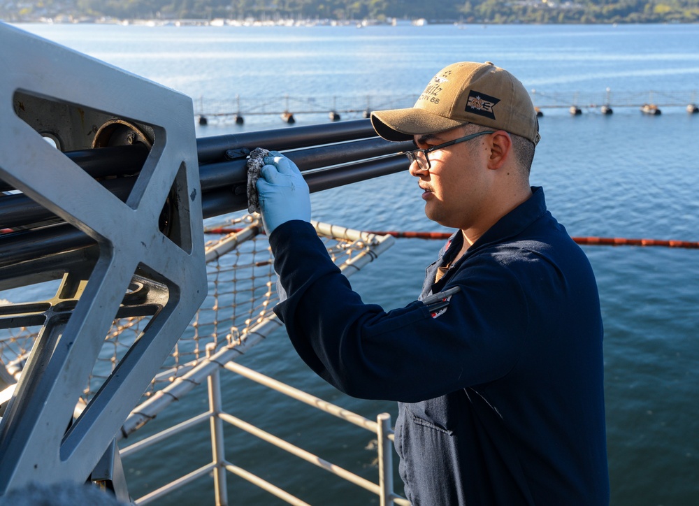 U.S. Navy Sailor Cleans Weapon Barrel