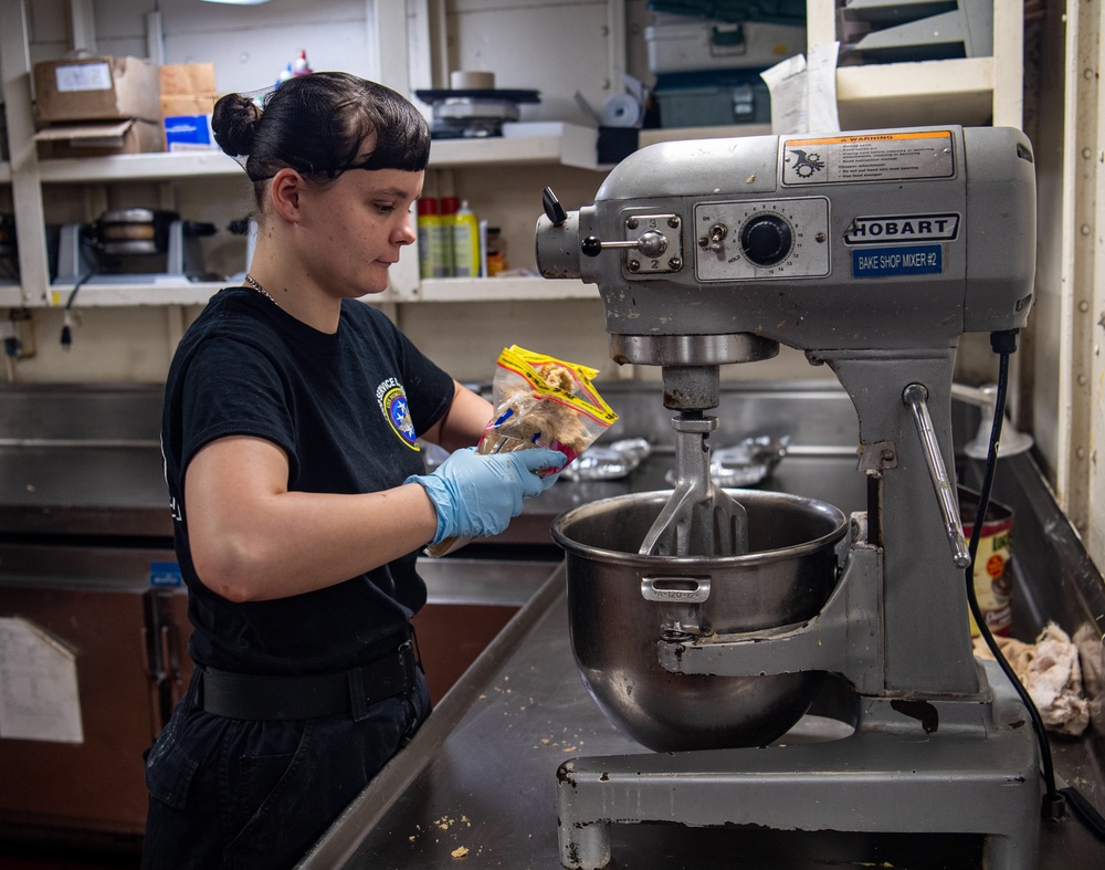 U.S. Navy Sailor Prepares Pie Crust