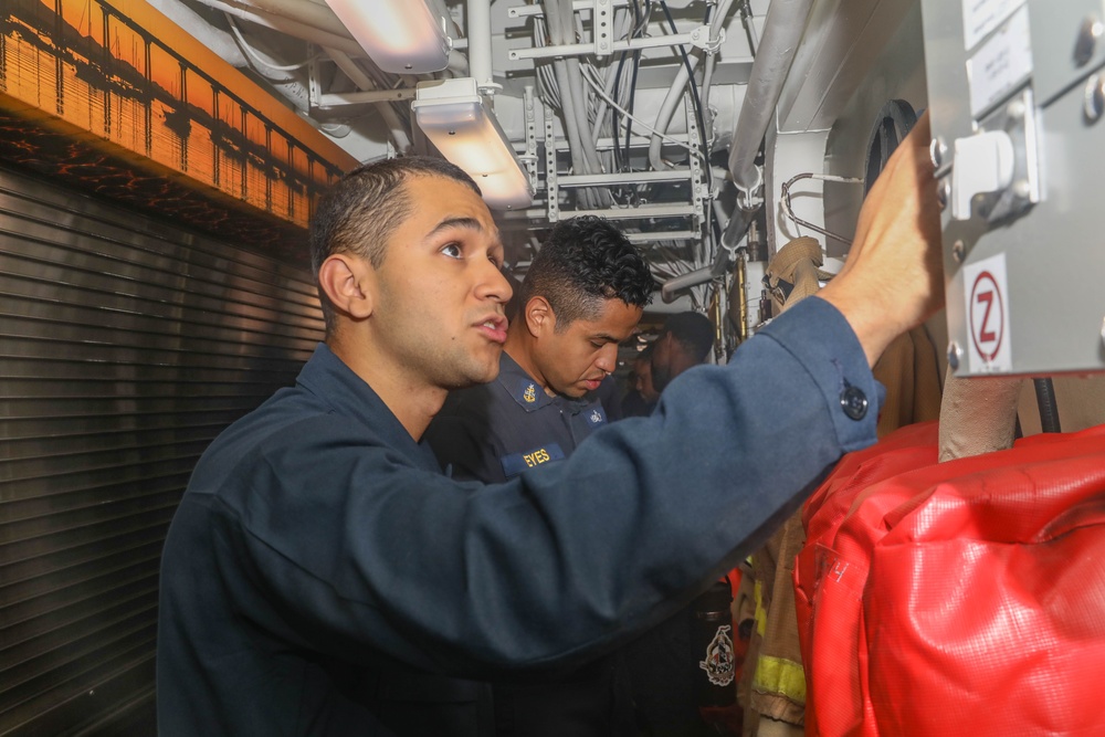 Arleigh Burke-class guided-missile destroyer USS Rafael Peralta (DDG 115) conduct a general quarters drill in the South China Sea