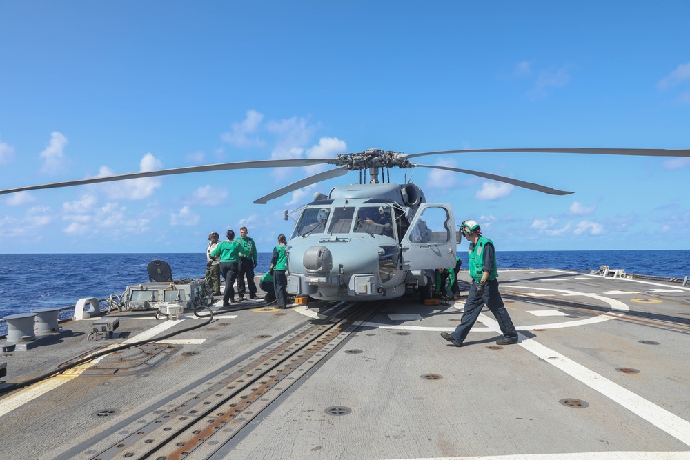 Sailors assigned to the Arleigh Burke-class guided-missile destroyer USS Rafael Peralta (DDG 115) conduct flight quarters in the Philippine Sea