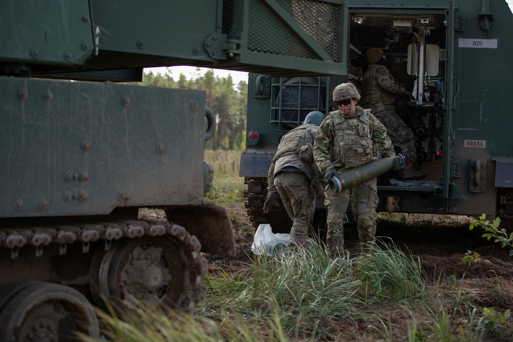 Task Force Marne Paladin crews provide artillery support during Exercise Iron Wolf