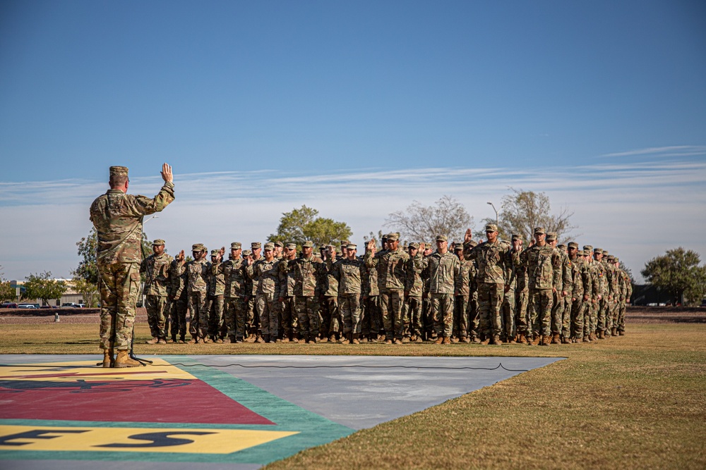 1AD CG re-enlists 120 Soldiers