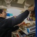 Retail Services Specialists restock the ship’s store aboard the Arleigh Burke-class guided-missile destroyer USS Rafael Peralta (DDG 115) in the Philippine Sea