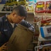 Retail Services Specialists restock the ship’s store aboard the Arleigh Burke-class guided-missile destroyer USS Rafael Peralta (DDG 115) in the Philippine Sea