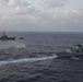 The Arleigh Burke-class guided-missile destroyer USS Rafael Peralta (DDG 115) sails alongside Royal Canadian Navy Halifax-class frigate HMCS Ottawa (FFH 341) in the South China Sea