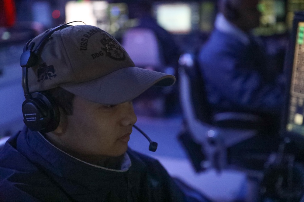 Sailors perform daily operations in the combat information center aboard the Arleigh Burke-class guided-missile destroyer USS Rafael Peralta (DDG 115) in the South China Sea