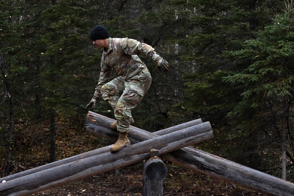 95th Chemical Company Soldiers tackle the obstacle course at JBER