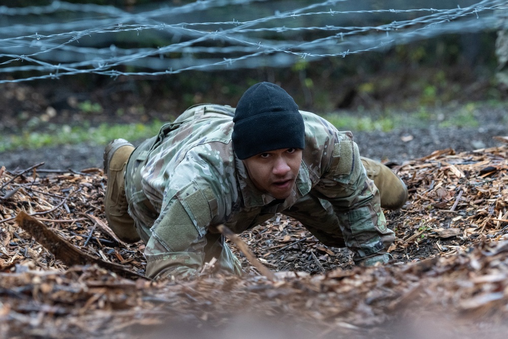 95th Chemical Company Soldiers tackle the obstacle course at JBER