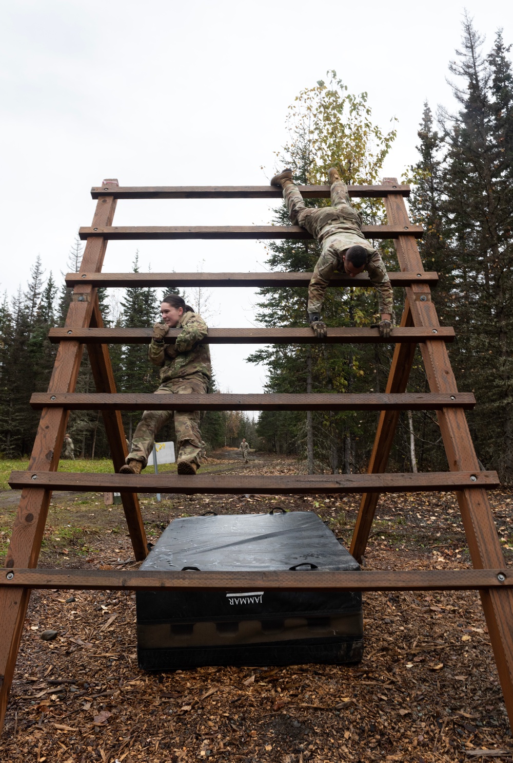 95th Chemical Company Soldiers tackle the obstacle course at JBER