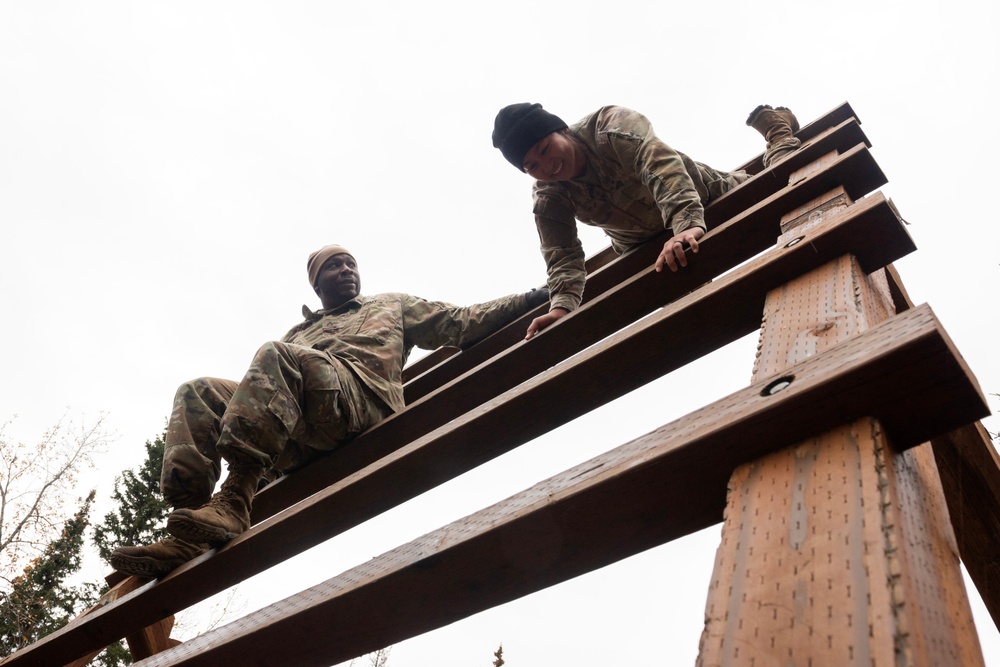 95th Chemical Company Soldiers tackle the obstacle course at JBER