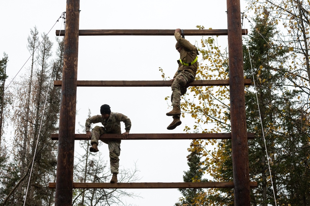 95th Chemical Company Soldiers tackle the obstacle course at JBER