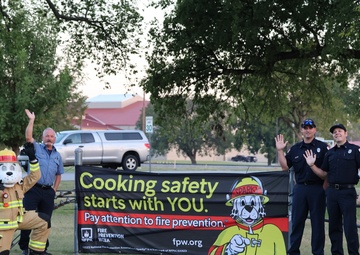 Sparky, firefighters wave to motorists to build awareness