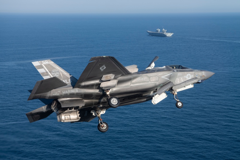 Two U.S. Navy F-35C fly in formation for a photo exercise and the
