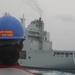Sailors aboard the USS Rafael Peralta (DDG 115) conducts a replenishment-at-sea with Royal Canadian Navy supply ship MV Asterix in the South China Sea