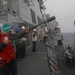 Sailors aboard the USS Rafael Peralta (DDG 115) conducts a replenishment-at-sea with Royal Canadian Navy supply ship MV Asterix in the South China Sea