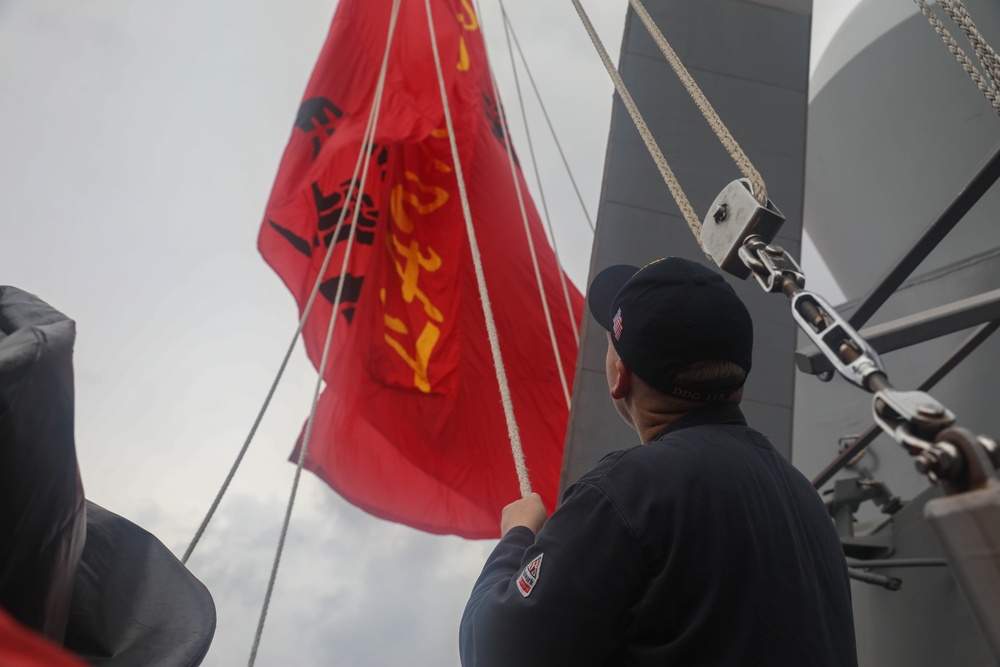 Sailors aboard the USS Rafael Peralta (DDG 115) conducts a replenishment-at-sea with Royal Canadian Navy supply ship MV Asterix in the South China Sea