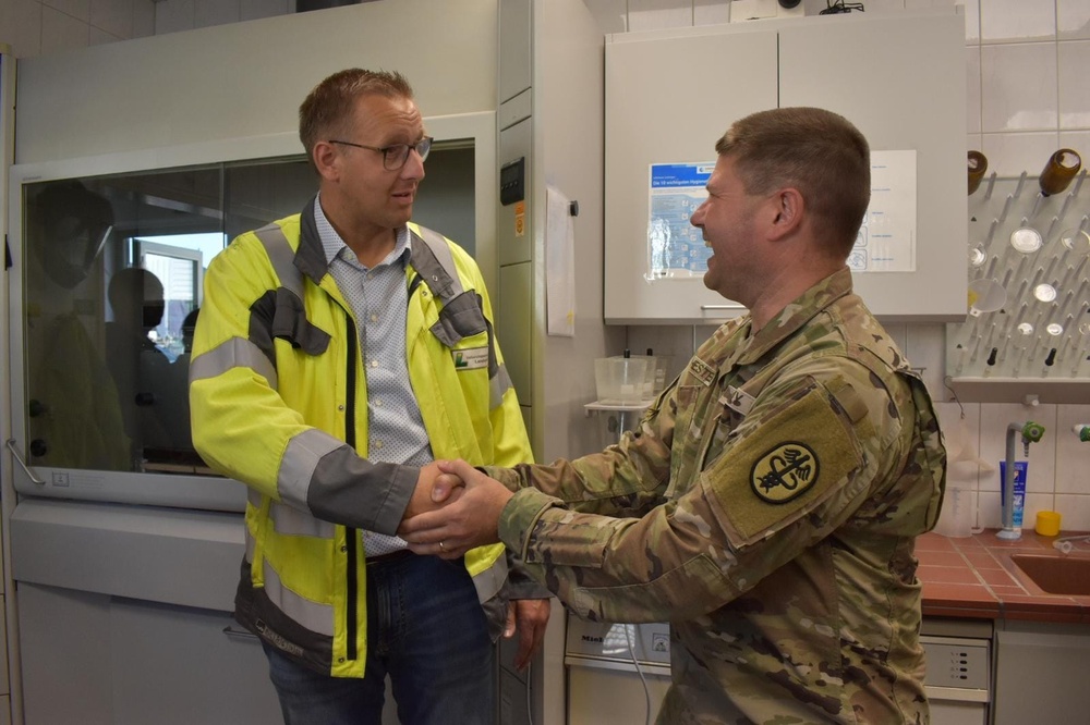 Frank Nesselberger, Deputy Director of the Technical Operations for the county of Landstuhl, shaking hands with Lt. Col. Paul Hester, Director of Environmental Health Sciences at Public Health Command Europe.