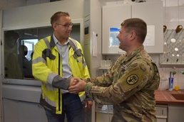 Frank Nesselberger, Deputy Director of the Technical Operations for the county of Landstuhl, shaking hands with Lt. Col. Paul Hester, Director of Environmental Health Sciences at Public Health Command Europe.