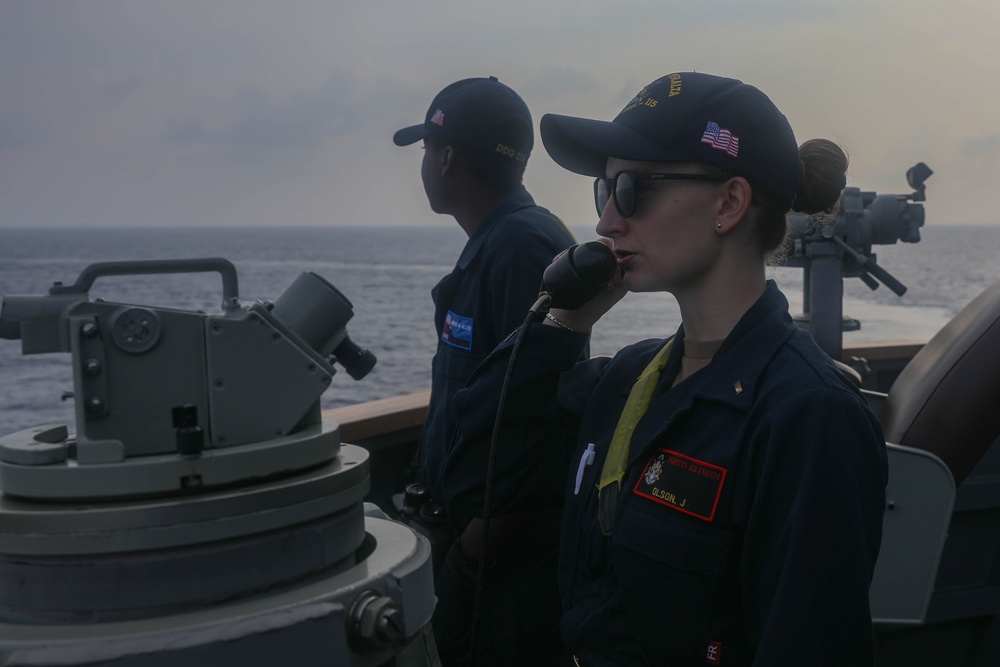 Sailors perform digital fluxgate magnetic compass (DFGMC) calibrations on the bridge aboard the USS Rafael Peralta (DDG 115) in the South China Sea