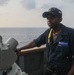 Sailors stand watch on the bridge aboard the USS Rafael Peralta (DDG 115) in the South China Sea