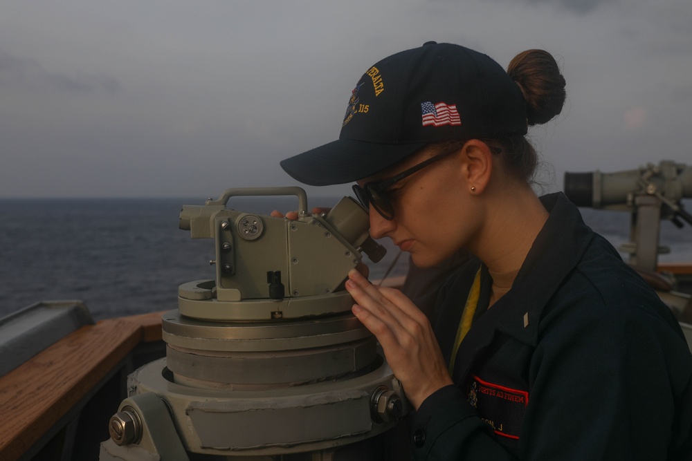 Sailors perform digital fluxgate magnetic compass (DFGMC) calibrations on the bridge aboard the USS Rafael Peralta (DDG 115) in the South China Sea