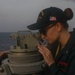 Sailors perform digital fluxgate magnetic compass (DFGMC) calibrations on the bridge aboard the USS Rafael Peralta (DDG 115) in the South China Sea