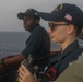 Sailors perform digital fluxgate magnetic compass (DFGMC) calibrations on the bridge aboard the USS Rafael Peralta (DDG 115) in the South China Sea