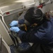 Sailors conduct engineering team drills aboard the USS Rafael Peralta (DDG 115) in the South China Sea
