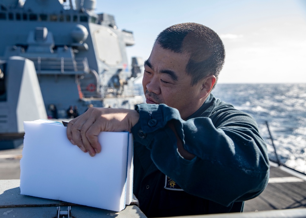 Sailors Conduct a Fresh-Water Wash Down Aboard USS John Finn (DDG 113)