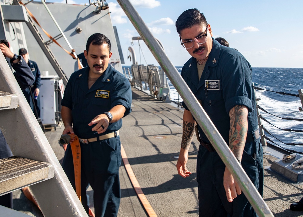 Sailors Conduct a Fresh-Water Wash Down Aboard USS John Finn (DDG 113)