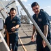 Sailors Conduct a Fresh-Water Wash Down Aboard USS John Finn (DDG 113)