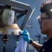 Sailors Conduct a Fresh-Water Wash Down Aboard USS John Finn (DDG 113)