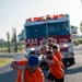 U.S. Navy Sailors, American and Spanish Firefighters participate in Firefighter Competition