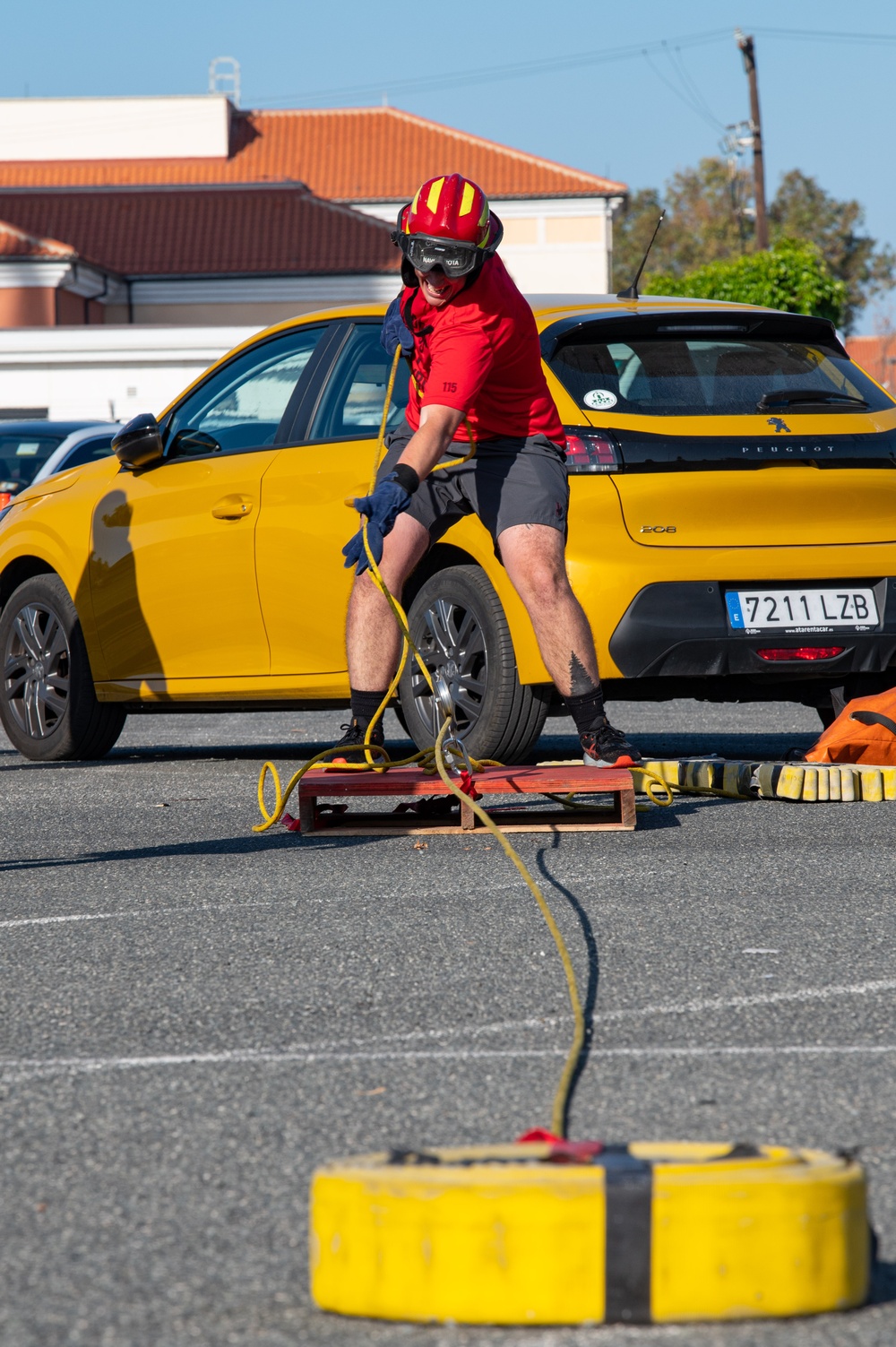 U.S. Navy Sailors, American and Spanish Firefighters participate in Firefighter Competition