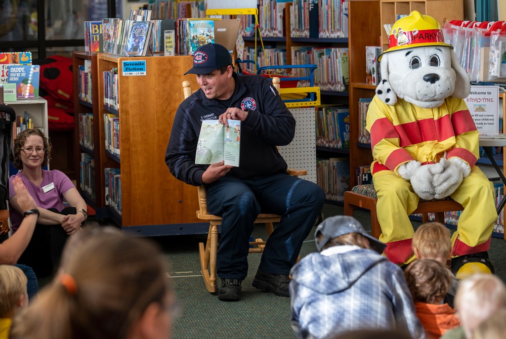 Sparky the Fire Dog Reads to Children at Fairchild Library