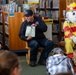 Sparky the Fire Dog Reads to Children at Fairchild Library