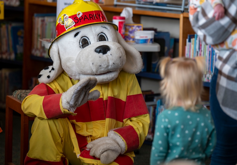 Sparky the Fire Dog Reads to Children at Fairchild Library