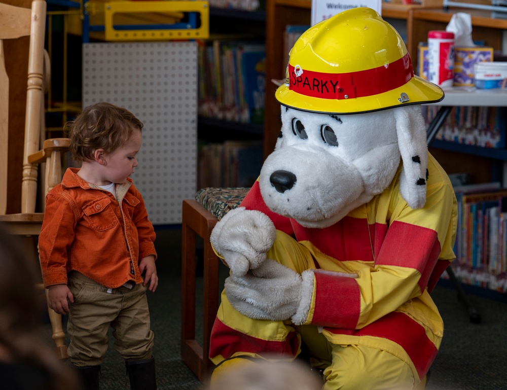 Sparky the Fire Dog Reads to Children at Fairchild Library