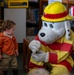 Sparky the Fire Dog Reads to Children at Fairchild Library