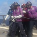 Sailors aboard the USS Rafael Peralta (DDG 115) conduct a crash and salvage drill