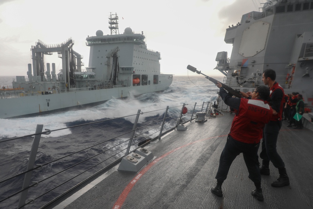 Sailors aboard the USS Rafael Peralta (DDG 115) conduct a replenishment-at-sea with Canadian Naval Replenishment Unit Asterix