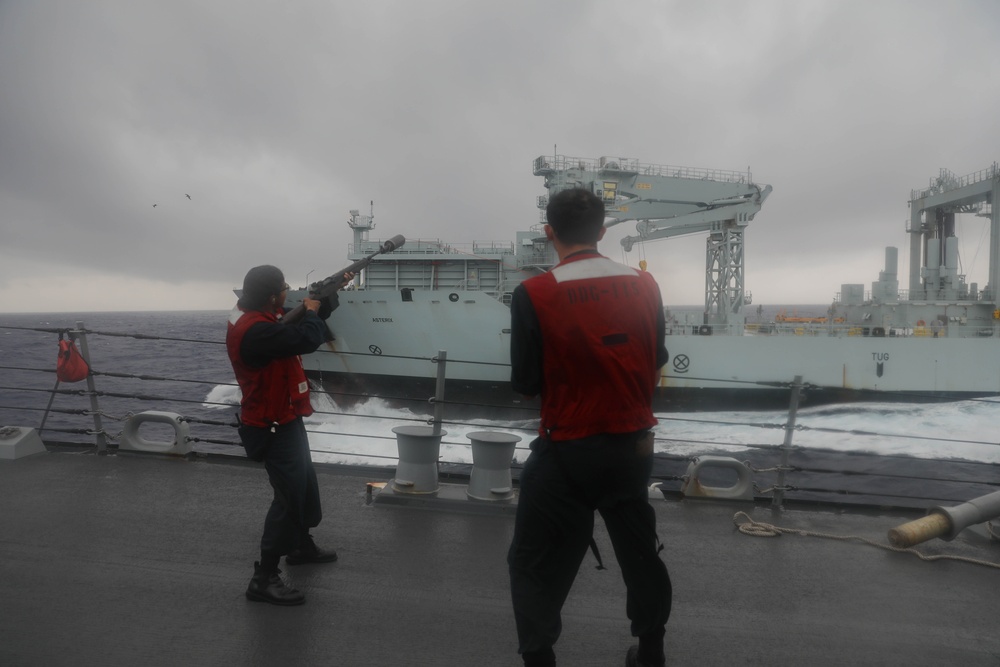 Sailors aboard the USS Rafael Peralta (DDG 115) conduct a replenishment-at-sea with Canadian Naval Replenishment Unit Asterix