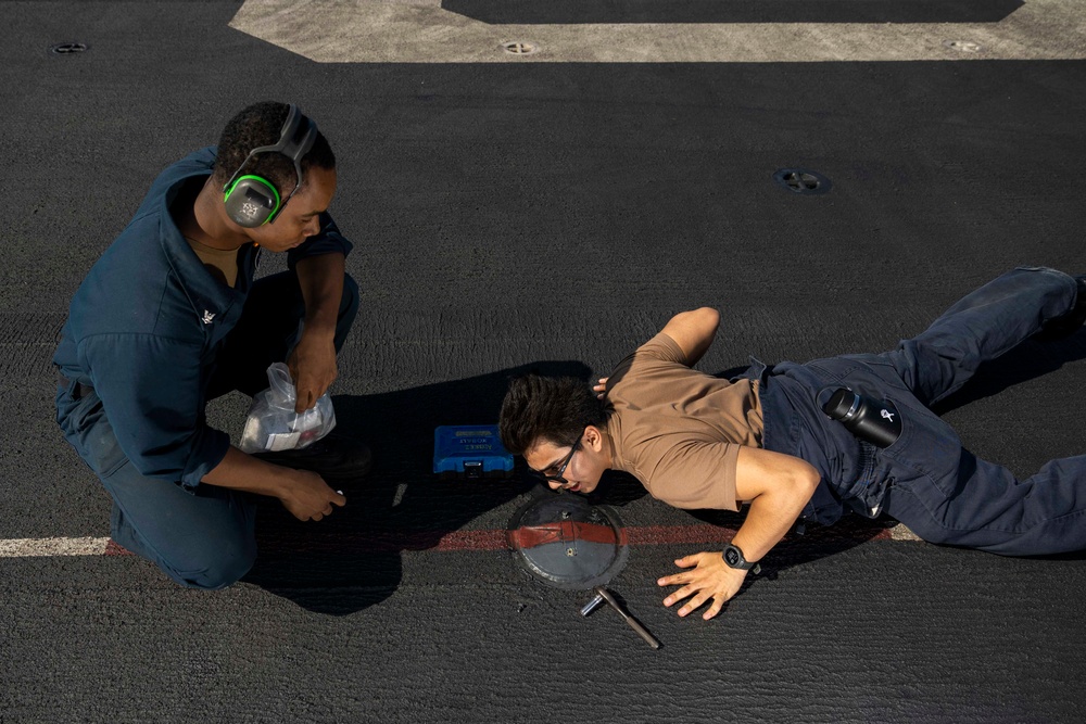 USS Bataan EMs Troubleshoot Flight Deck Lights