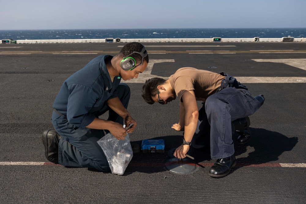 USS Bataan EMs Troubleshoot Flight Deck Lights