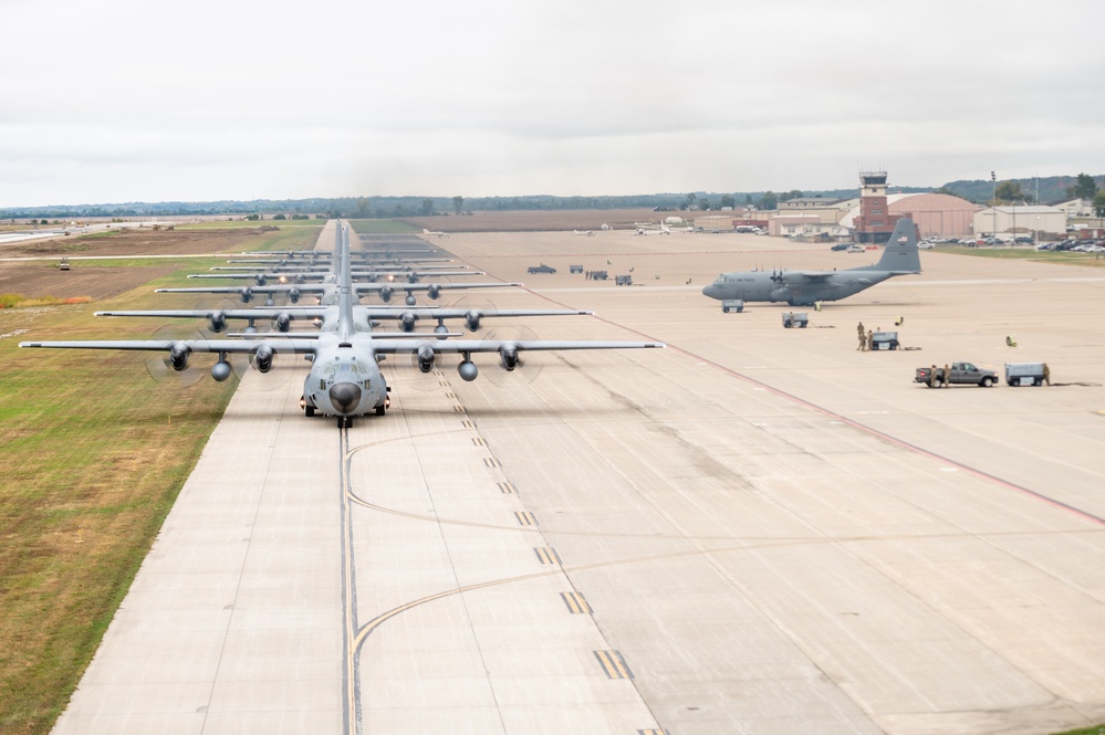 Seven C-130 Hercules aircraft perform ‘elephant walk’