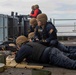 Abraham Lincoln Sailors participate in a live-fire exercise