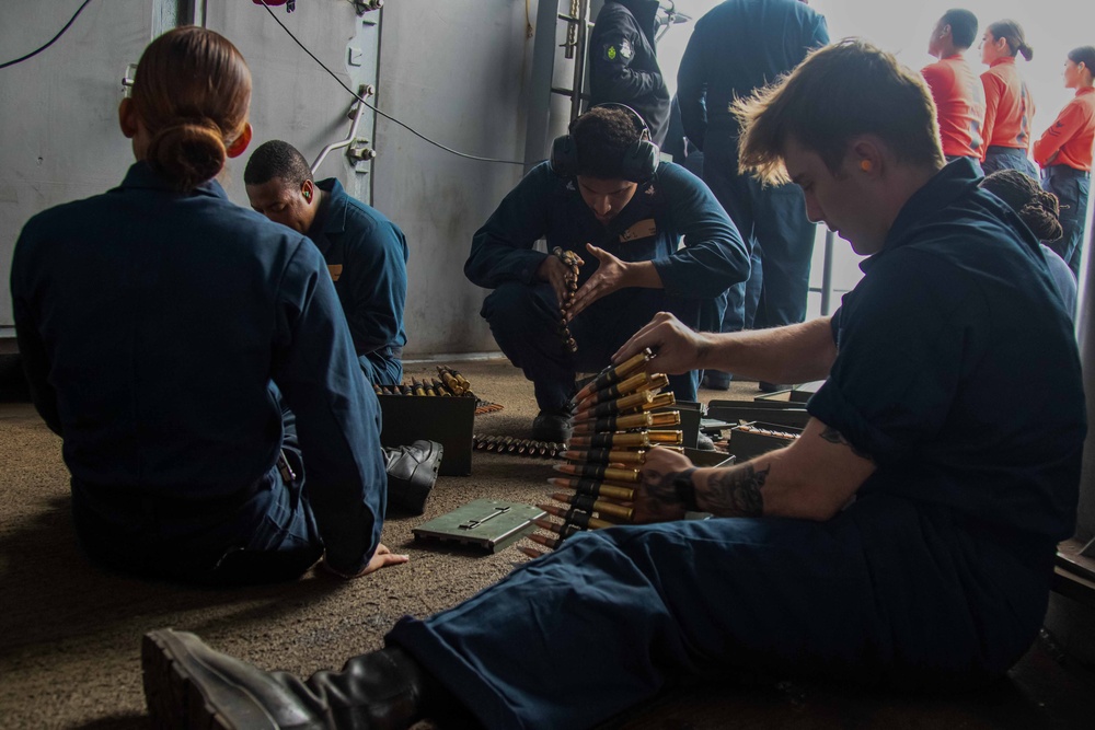 Abraham Lincoln Sailors participate in a live-fire exercise