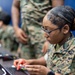 Service members and residents participate in an Emergency Evacuation Program exercise