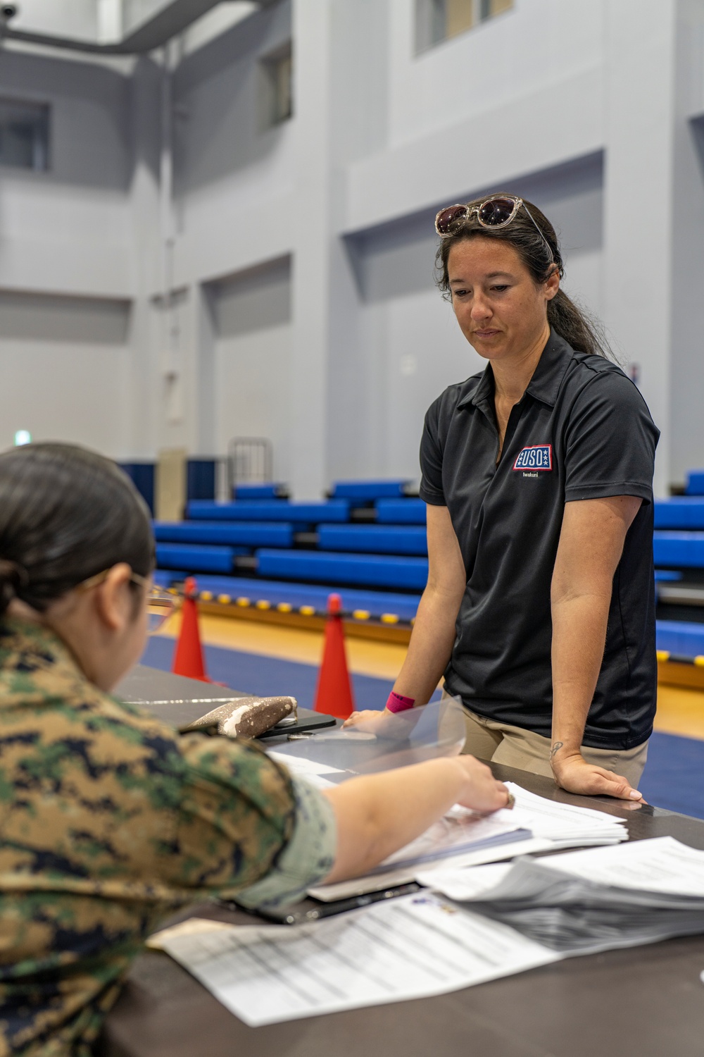 Service members and residents participate in an Emergency Evacuation Program exercise