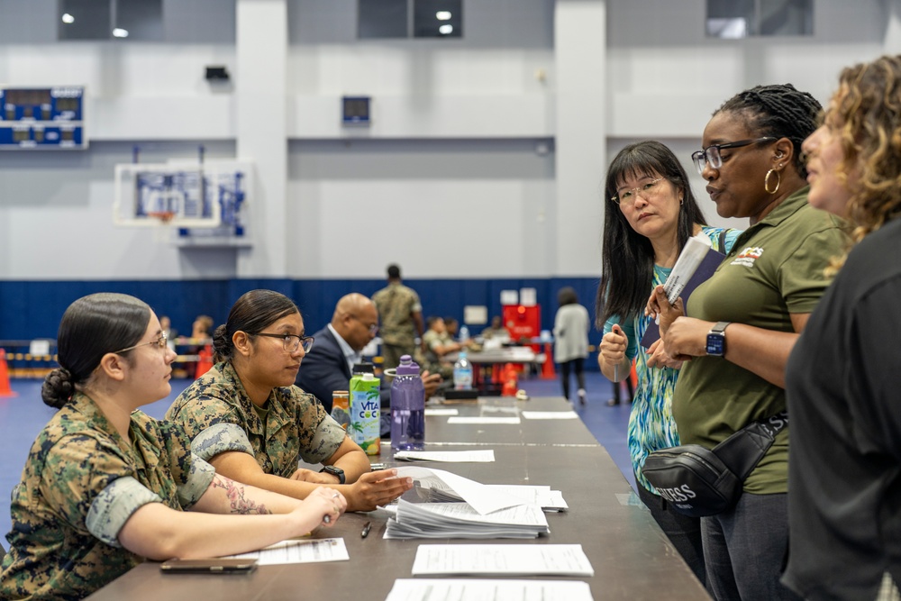 Service members and residents participate in an Emergency Evacuation Program exercise